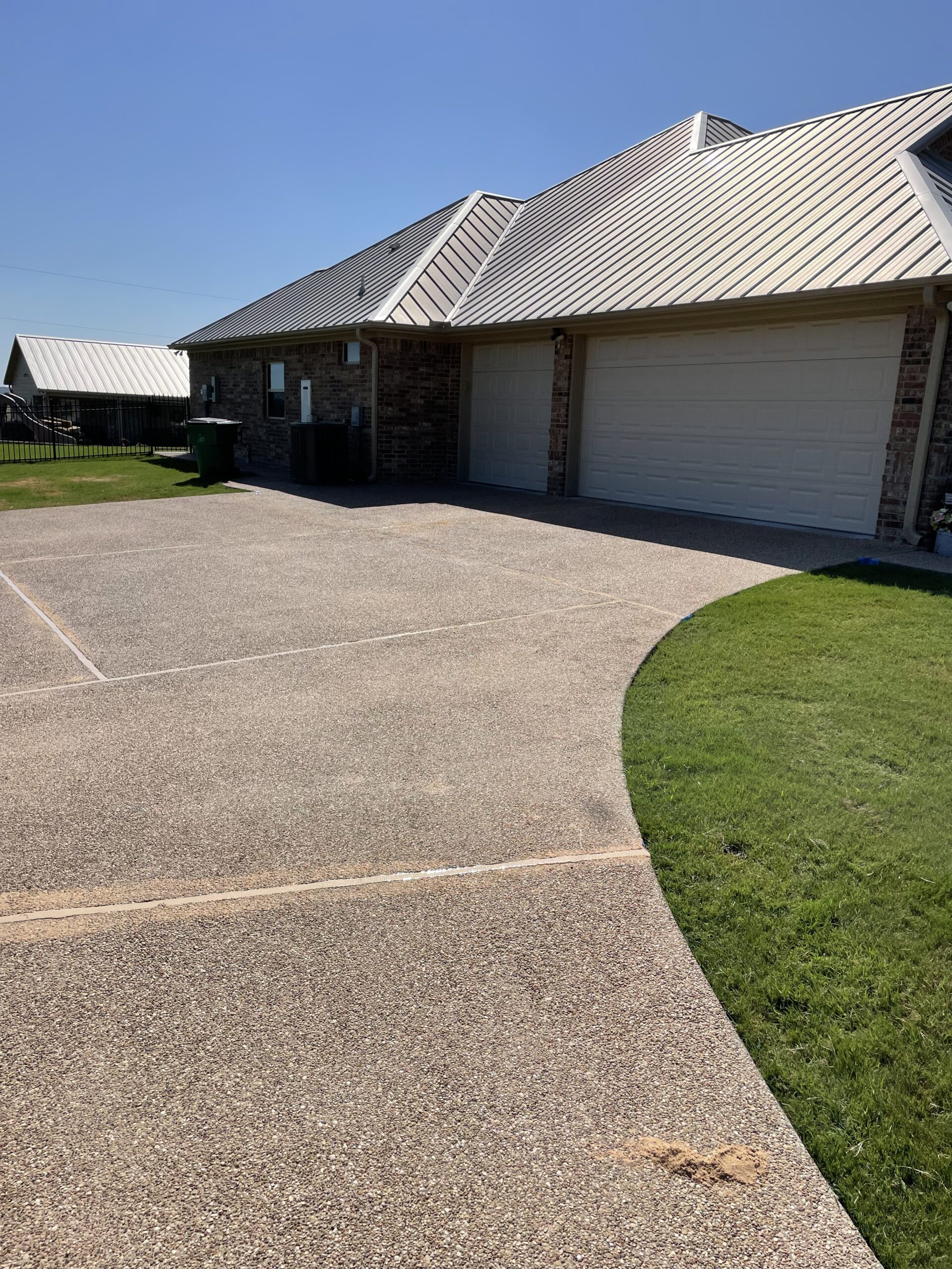 A team member from Precision Foundation Repair expertly working on a concrete leveling project in Stephenville, Texas.