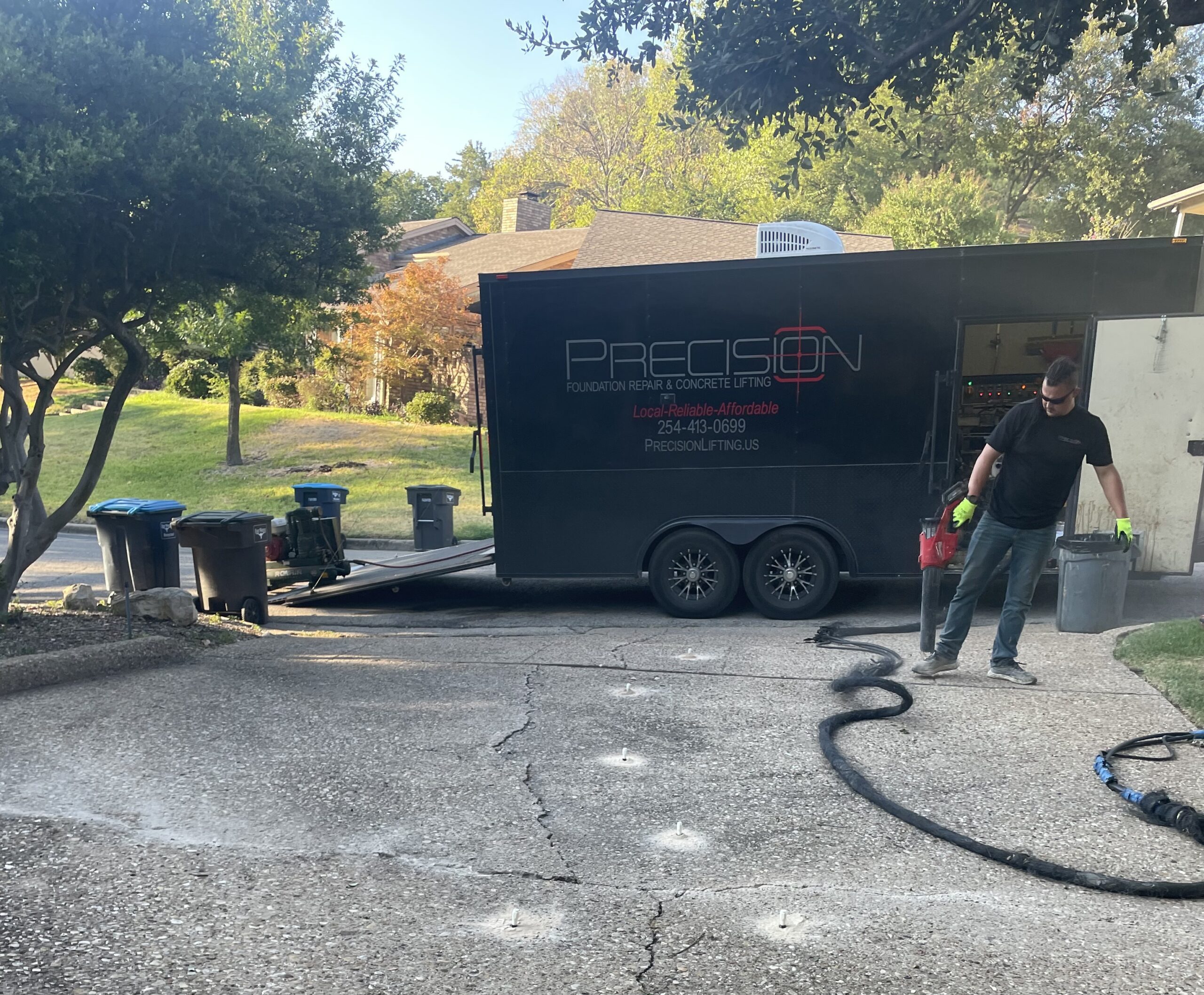 A team from Precision Foundation Repair uses a hose to inject polyurethane foam for a home foundation repair in Stephenville, Texas. A team from Precision Foundation Repair uses a hose to inject polyurethane foam for a home foundation repair in Stephenville, Texas.