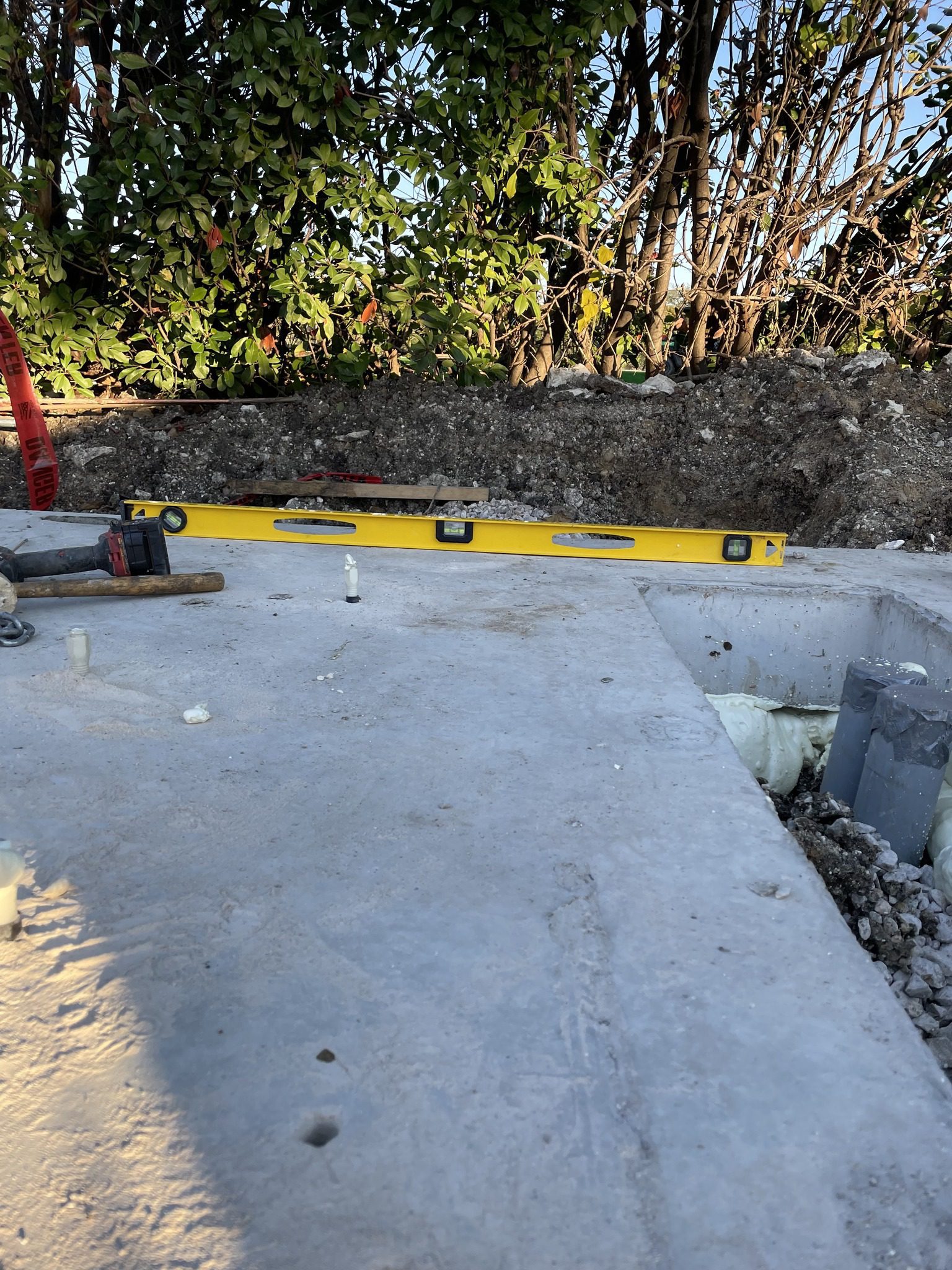 High-density polyurethane foam being injected into a sunken concrete patio slab to restore level at a residential home in Azle, Texas. High-density polyurethane foam being injected into a sunken concrete patio slab to restore level at a residential home in Azle, Texas.