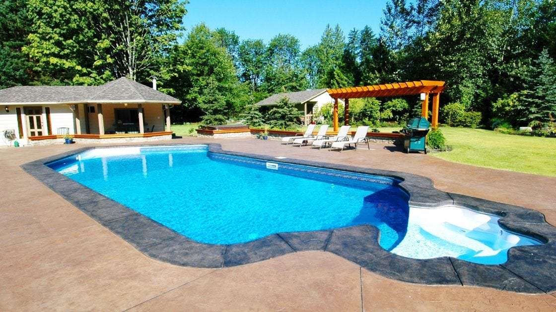 A specialized technician from Precision Foundation Repair injecting foam to level a concrete pool deck near a swimming pool in Granbury, Texas. A specialized technician from Precision Foundation Repair injecting foam to level a concrete pool deck near a swimming pool in Granbury, Texas.