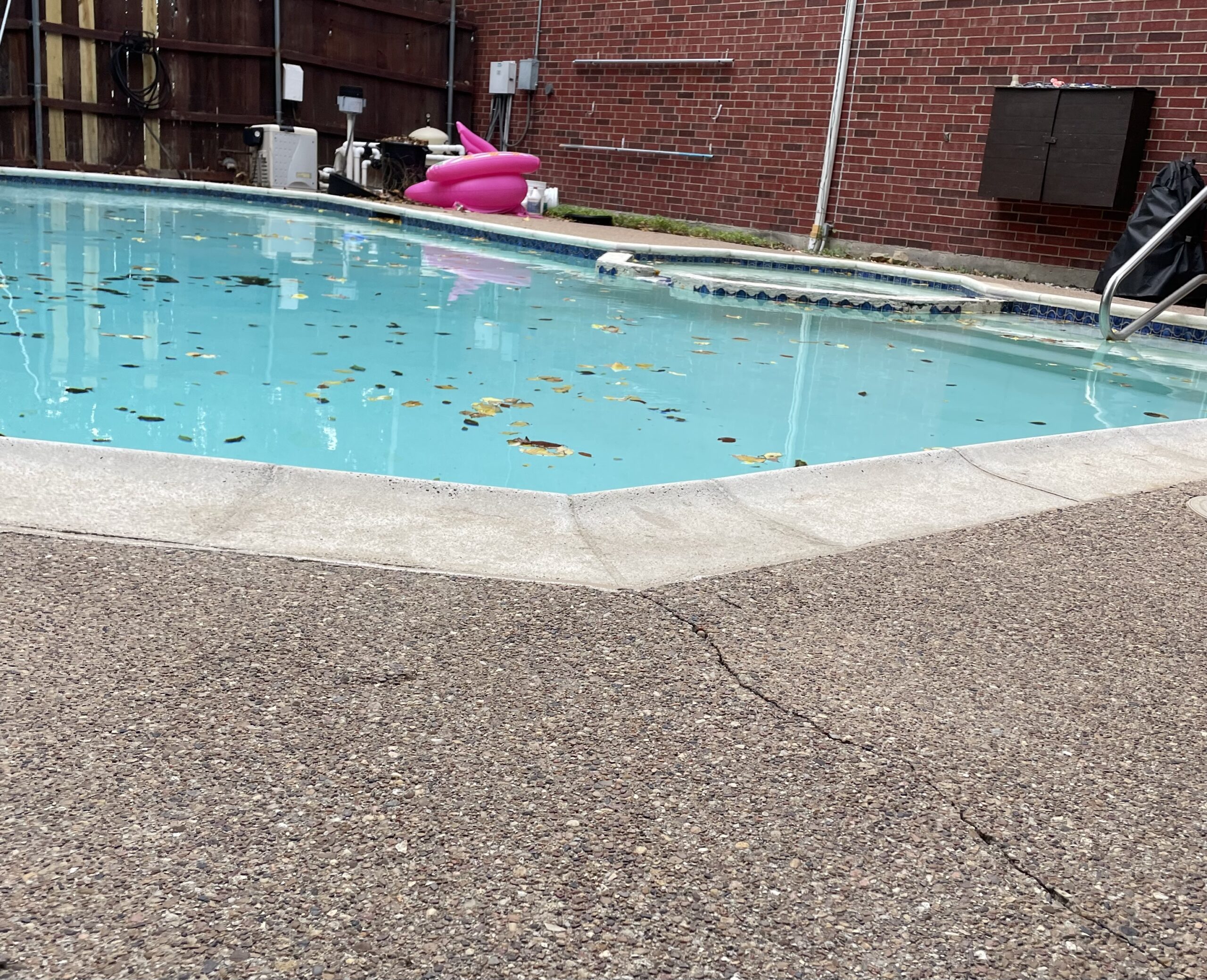 Precision Foundation Repair team injecting foam to repair a sagging concrete pool deck in a Stephenville, Texas backyard. Precision Foundation Repair team injecting foam to repair a sagging concrete pool deck in a Stephenville, Texas backyard.